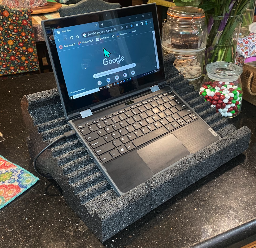 Fomatek Stand Model 23D in Charcoal - demonstrated with 13" laptop