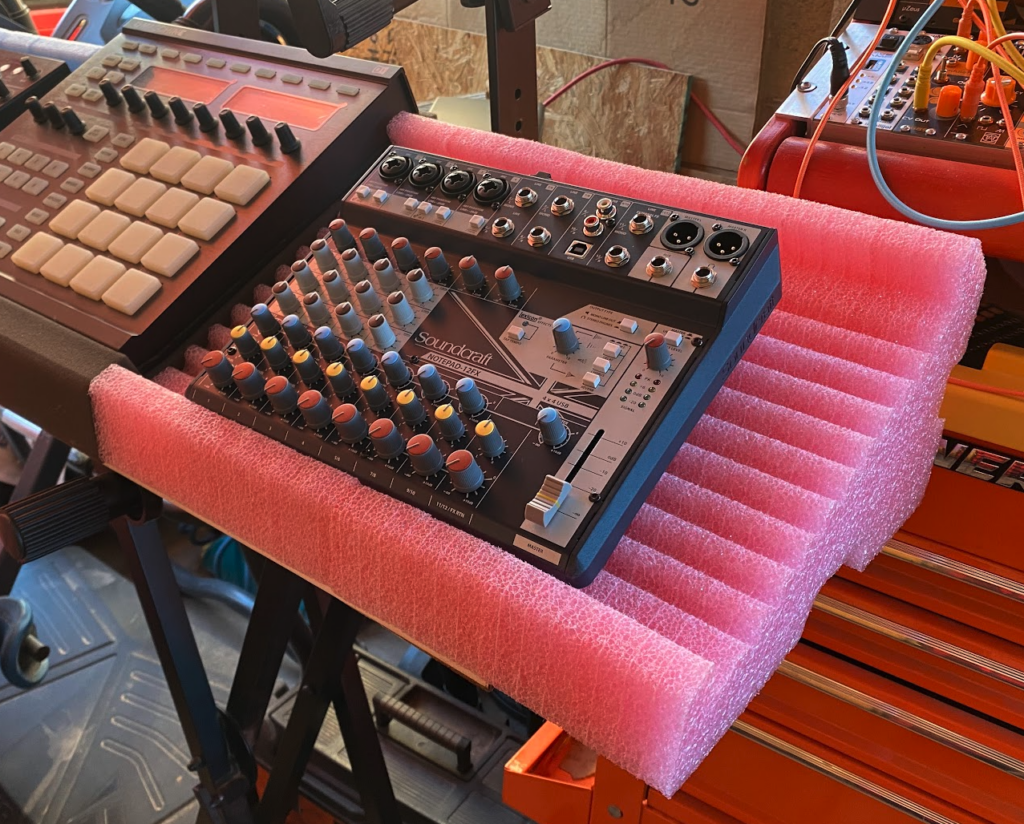 Fomatek Stand Model 23D - shown in pink with a Soundcraft Notepad 12ch Mixer